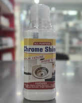 Bottle of chrome shine cleaner with a label on a reflective surface.