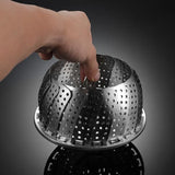 Collapsible stainless steel steamer basket for convenient steaming in pots of various sizes.