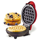 Waffle maker with a stack of blueberry waffles on a white background