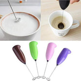 Electric handheld coffee and egg whisk for mixing coffee, frothing milk, whisking eggs, and preparing beverages.