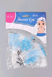 Shower cap with floral design in packaging on a gray background