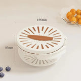 White kitchen tool with brown accents on a light background, showing measurements.