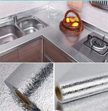 Heat-resistant aluminum foil wall sticker for use behind stoves, sinks, and kitchen workspaces.