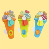 Three colorful ice cream toy cones on a yellow background