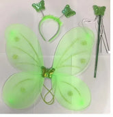 A green fairy costume accessory set on a white background, including a large translucent butterfly wing piece with glittery green veins and a butterfly center, a green headband with butterfly decorations, and a green wand with a butterfly topper.