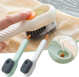 Cleaning brush with a hand holding it, used on a surface, with close-up of bristle detail.