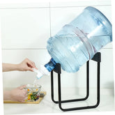Metal water bottle stand with dispensing nozzle for convenient and controlled water pouring.