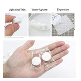 White tablets being held in a hand with text labels on lightness, water uptake, and expansion.