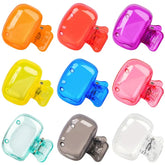 Set of colorful hair clips on a white background