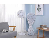 Decorative standing fans with covers in a living room setting.