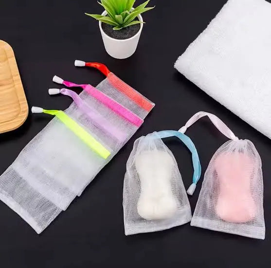 Reusable mesh soap saver drain pouch for storing soap while promoting quick drainage and drying.