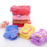 Soft microfiber hair drying cap for women with a bow design for quick and comfortable hair drying.