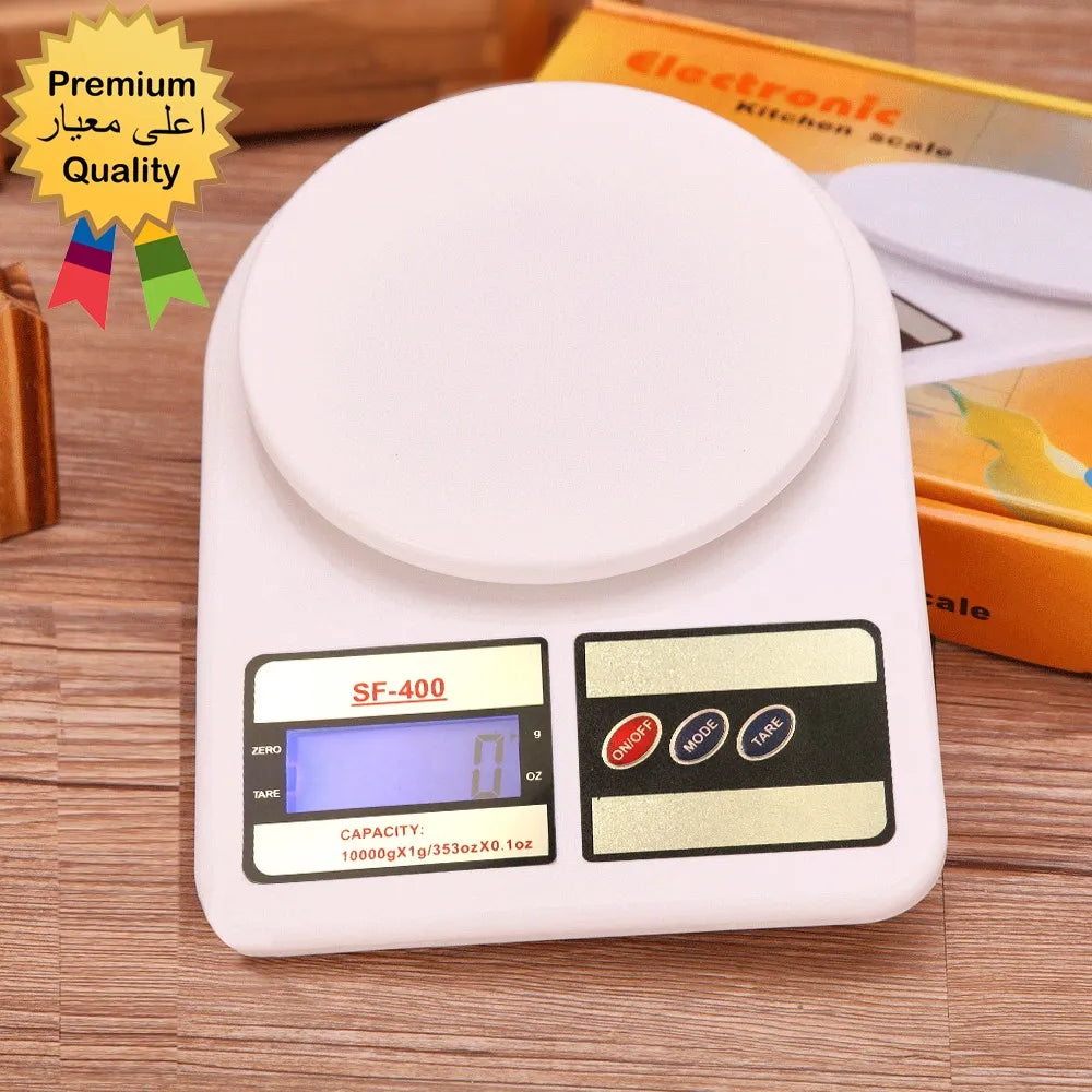 Digital kitchen scale with a visible brand name on a wooden surface