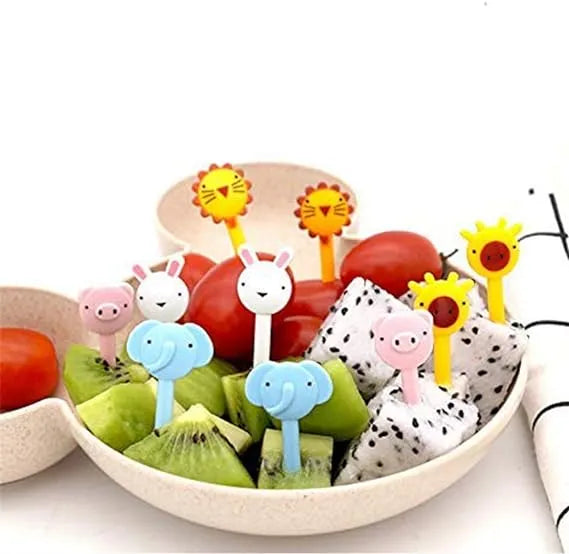 Fruit skewers with animal-themed toothpicks in a bowl of fruit.
