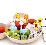 Fruit skewers with animal-themed toothpicks in a bowl of fruit.