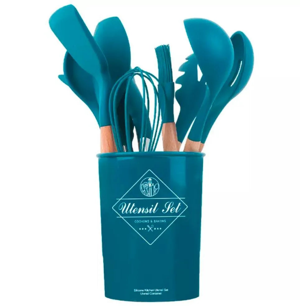 Set of teal kitchen utensils in a container with a visible brand logo on a white background