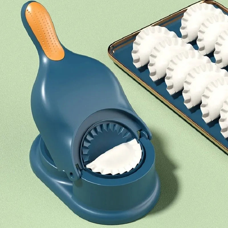 Blue dough press with an orange handle next to a tray of shaped dough on a light green background
