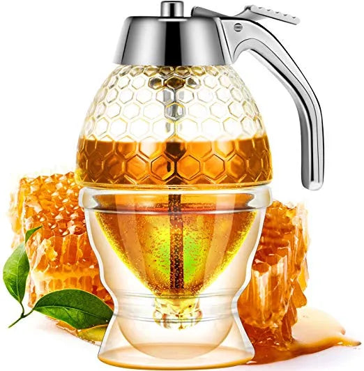 Honey dispenser with honeycomb and honey on a white background