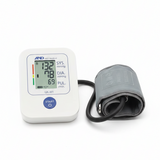 Blood pressure monitor with digital display on a white background