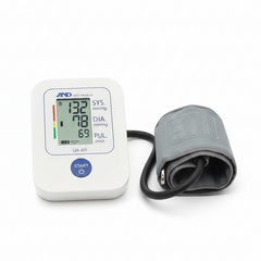 Blood pressure monitor with digital display on a white background