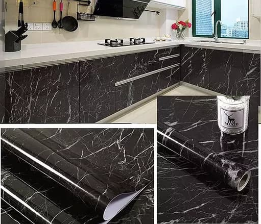 Black marble texture vinyl wrap applied to a kitchen countertop.