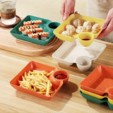 Colorful snack trays with food on a wooden table