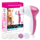 Pink and white 5-in-1 beauty care massager with packaging on a white background