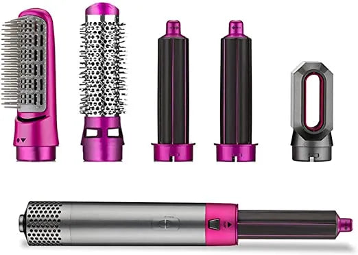 Set of hair styling tools with pink and black accents on a white background