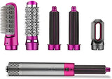 Set of hair styling tools with pink and black accents on a white background