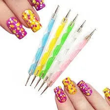 Nail art tools with colorful nail designs on nails