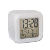 7-color digital alarm clock with glowing LED display for bedside and home use.