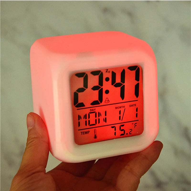 7-color LED digital glow alarm clock with vibrant display, time, date, and alarm functions.