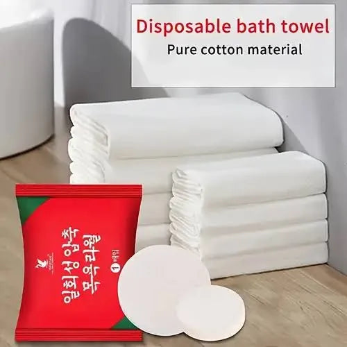 Disposable bath towel with pure cotton material packaging on a wooden surface.