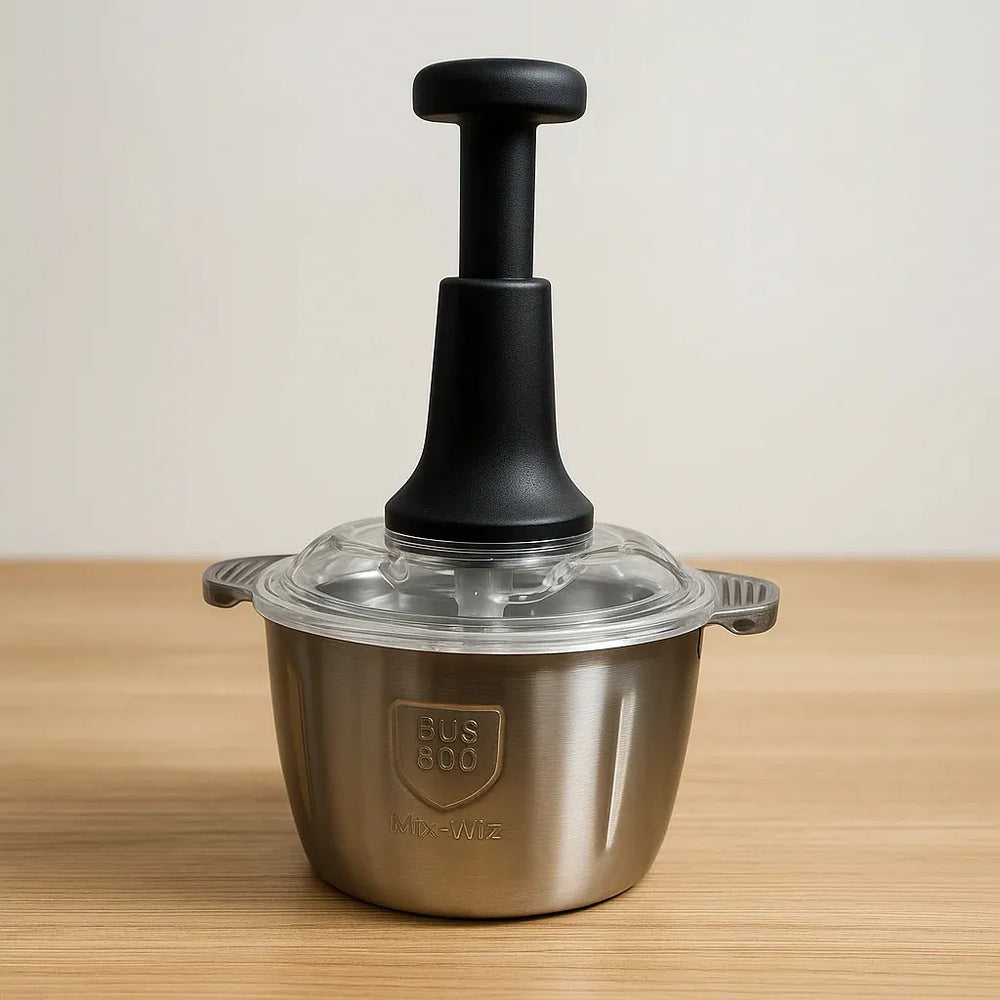 Stainless steel kitchen tool with black handle on a wooden surface