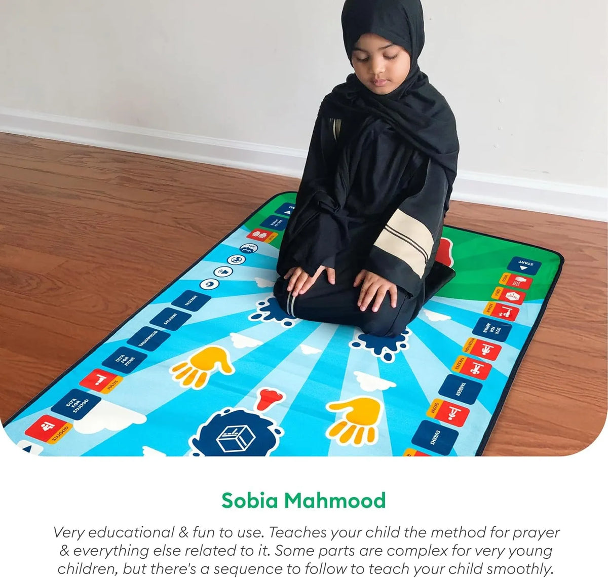 Child sitting on a colorful prayer mat with educational symbols