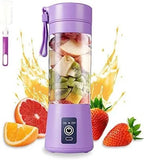 Purple portable blender with fruits inside, surrounded by fruit slices and splashes on a white background