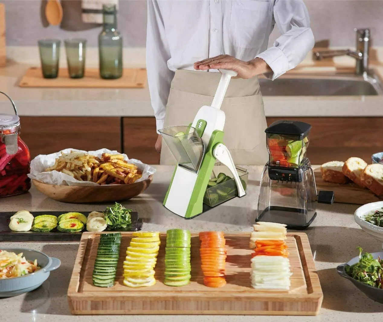 Person using a vegetable slicer with sliced vegetables on a kitchen counter.