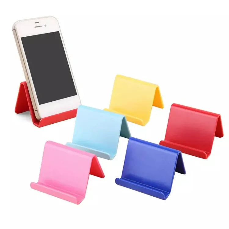 Set of colorful phone stands with a smartphone on a white background