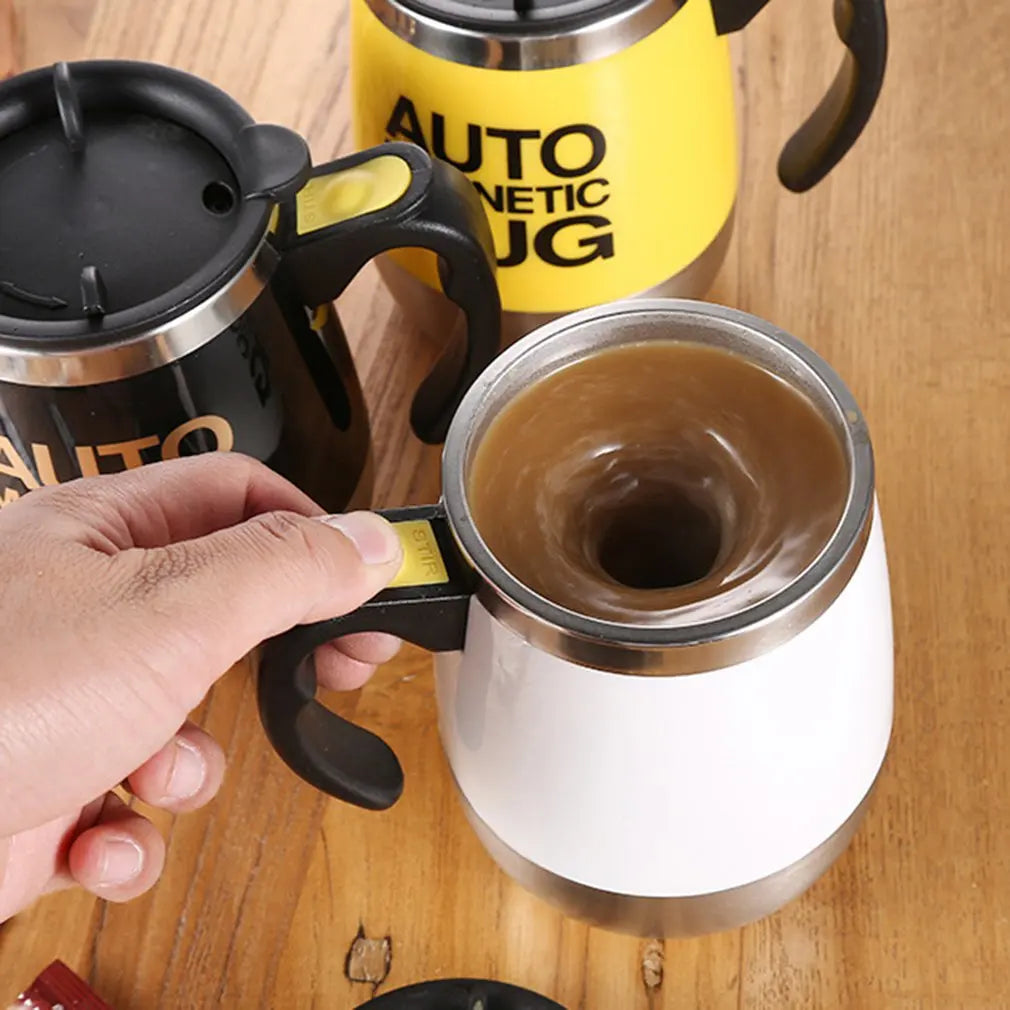Hand holding a coffee mug with a yellow 'Auto Netic Mug' in the background on a wooden surface.