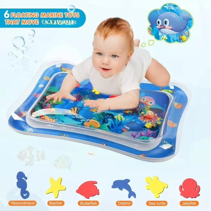 Baby playing on an inflatable water mat with marine toy figures.