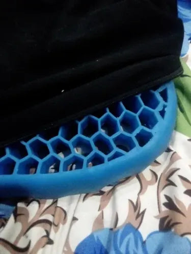 Honeycomb gel seat cushion with a breathable design for enhanced comfort during long sitting periods.