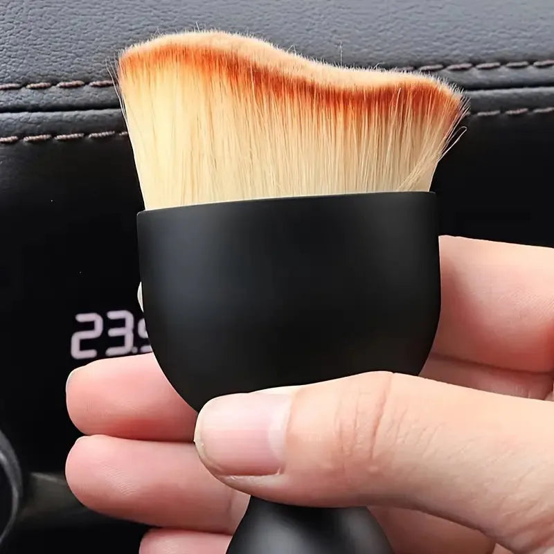 Car dusting detail brush for removing dirt and dust from vents, buttons, and trim pieces.