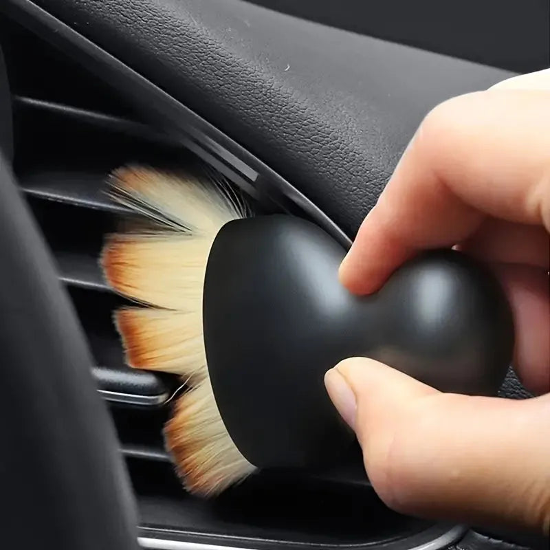 Car interior cleaning brush with soft bristles for dusting dashboards, consoles, air vents, and panels.