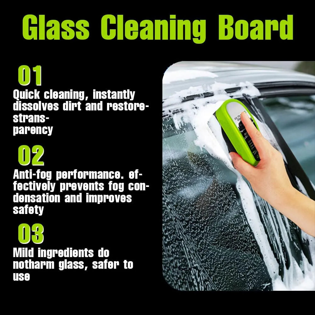 Glass cleaning board with a hand holding a green device against a car window.