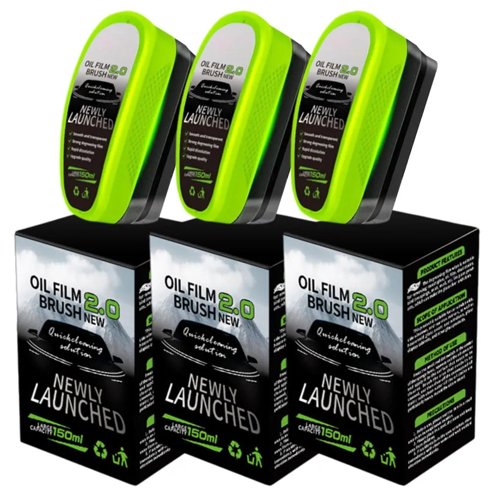 Three oil film brush 2.0 products with green tops on black boxes against a white background.