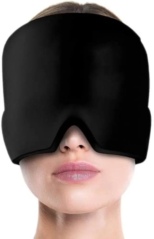A black sleep mask worn by a model, shown from the nose down against a plain white background.