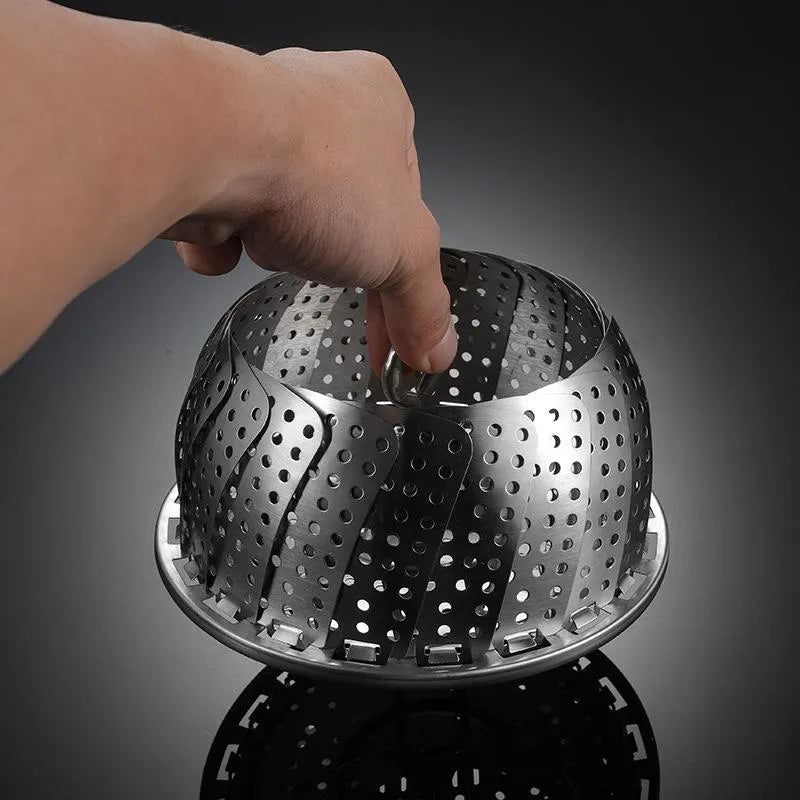 Collapsible stainless steel steamer basket for convenient steaming in pots of various sizes.