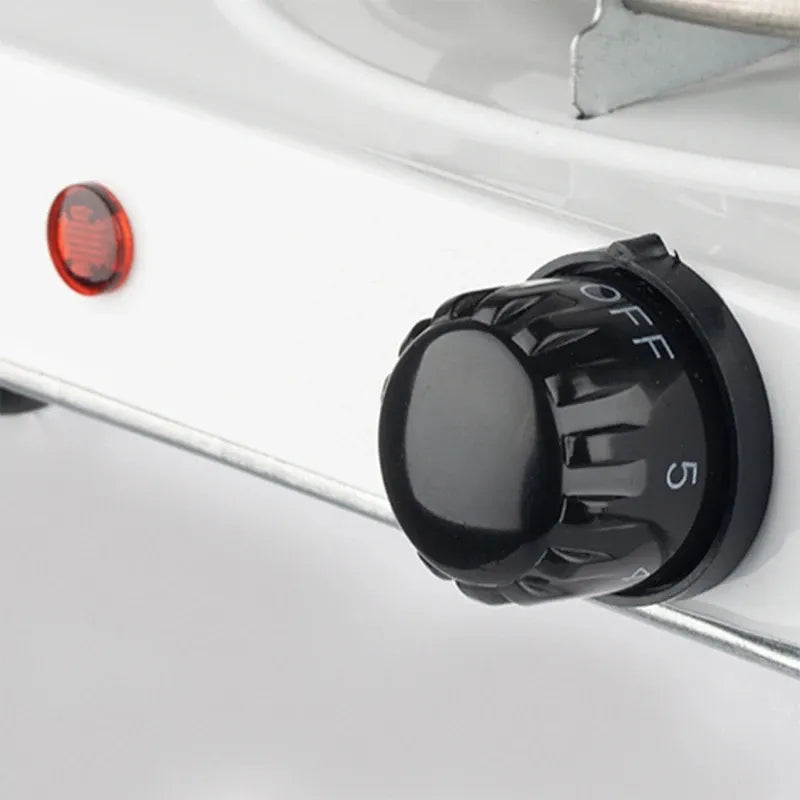 Compact electric cooker hot plate suitable for small kitchens, offices, and travel use.