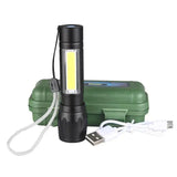 Black flashlight with USB cable and green carrying case on a white background