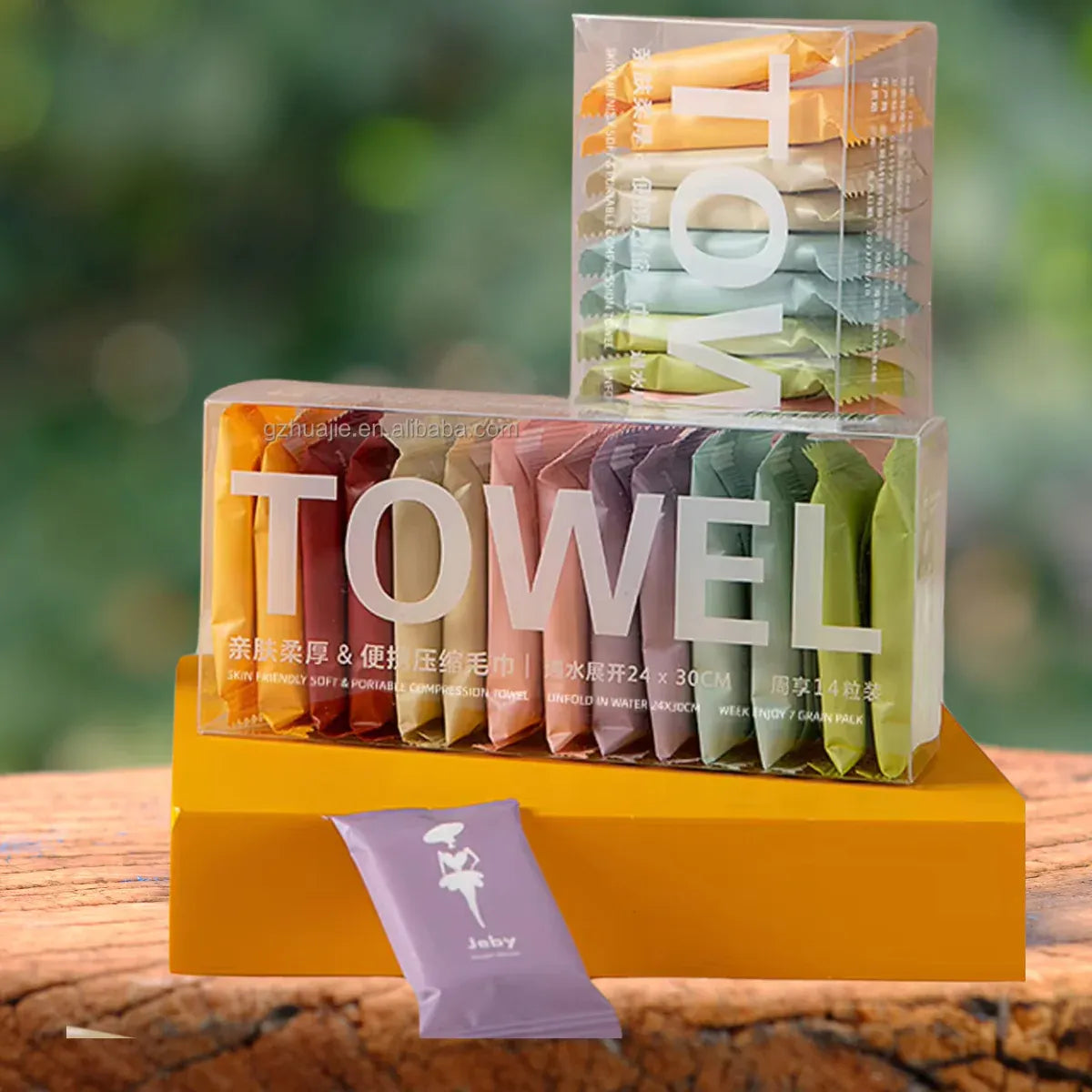 14-piece disposable compressed travel washcloths that expand with water for convenient personal cleaning.